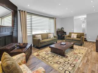 Step into this inviting living space, perfect for relaxation and entertaining.
