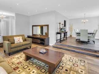 Step into luxury with this stunning living space, featuring a seamless blend of modern design and inviting comfort.
