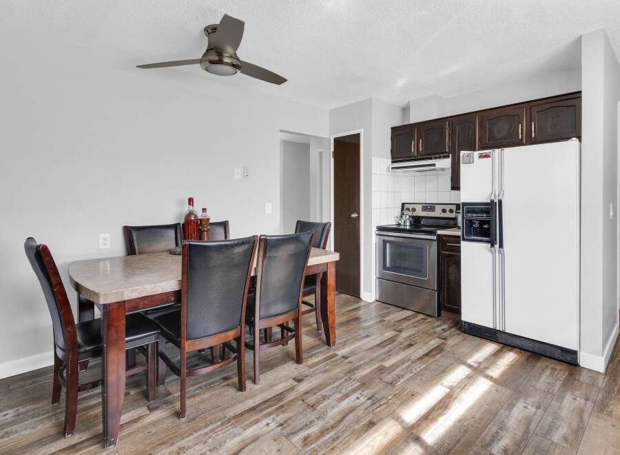 Step into this inviting kitchen and dining area, perfect for both everyday living and entertaining.