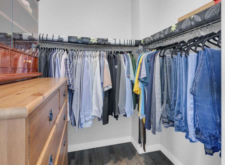Step into a well-organized walk-in closet, perfect for maximizing storage space.