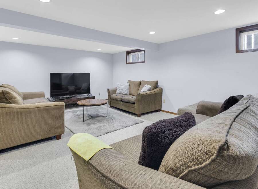 This cozy living room features a comfortable seating area, perfect for relaxing or entertaining.