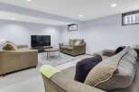 This cozy living room features a comfortable seating area, perfect for relaxing or entertaining.
