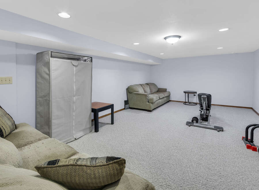 This spacious basement offers a versatile living space, perfect for relaxation and recreation.