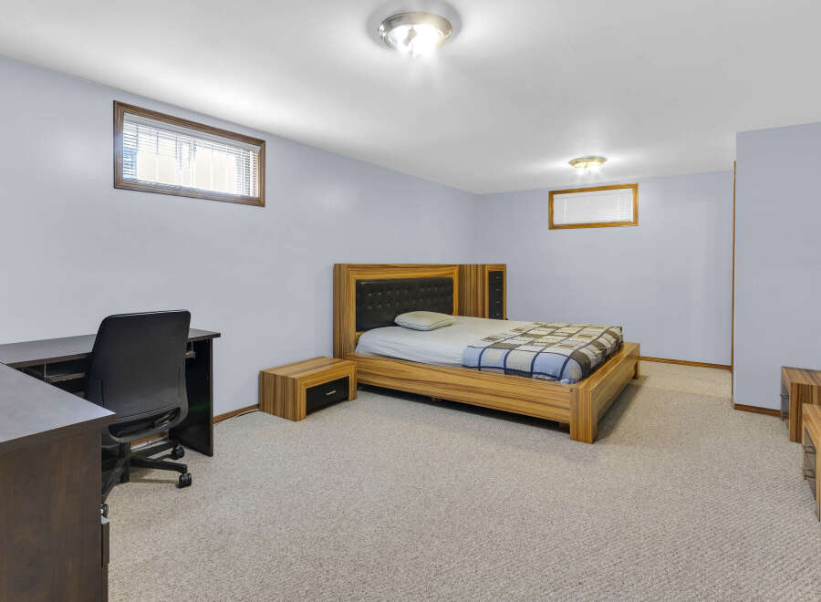 This bedroom offers a cozy and inviting atmosphere, perfect for relaxation.