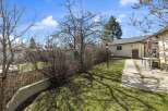 Discover this charming property featuring a well-maintained yard and a welcoming pathway.