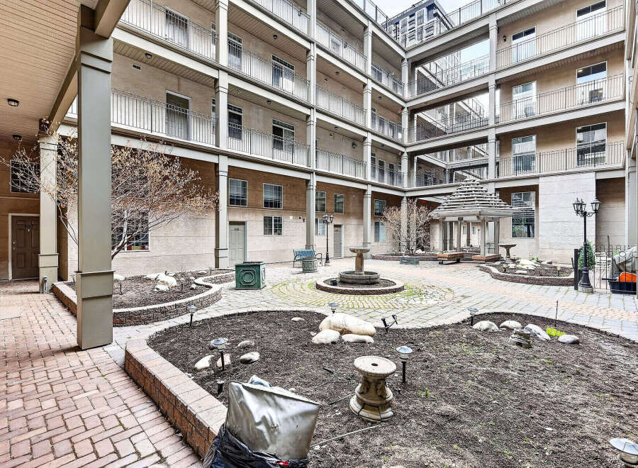 Discover a serene courtyard oasis, perfect for relaxation and community gatherings.