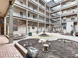 Discover a serene courtyard oasis, perfect for relaxation and community gatherings.