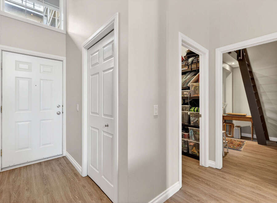 Step into this inviting entryway, showcasing a bright and airy atmosphere.