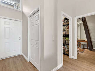Step into this inviting entryway, showcasing a bright and airy atmosphere.