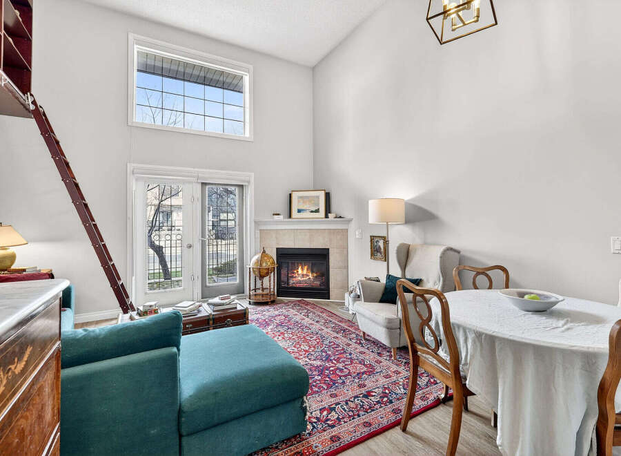 This stunning property boasts a cozy living room with a fireplace, perfect for relaxing evenings.