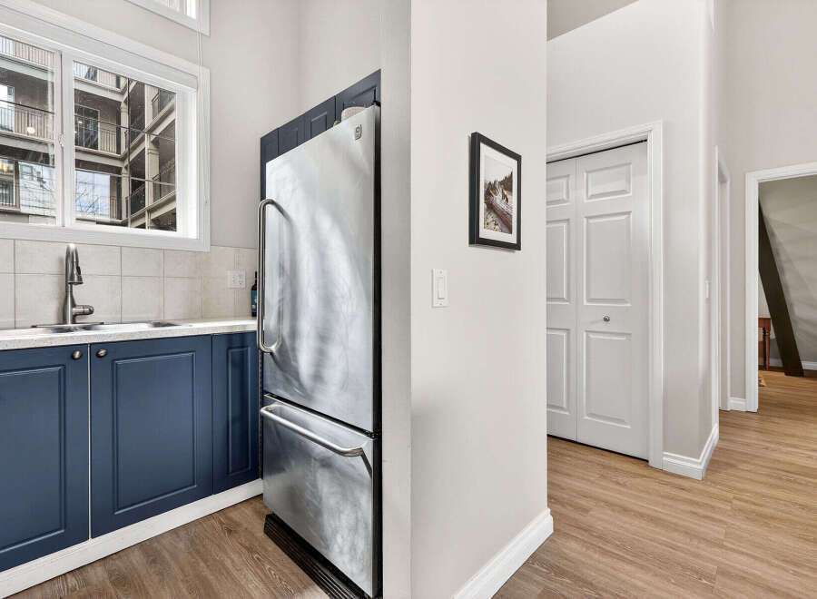 Discover this stunning property featuring a modern kitchen with stainless steel appliances and sleek cabinetry.