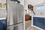 This stunning property boasts a modern kitchen with stainless steel appliances and ample storage.