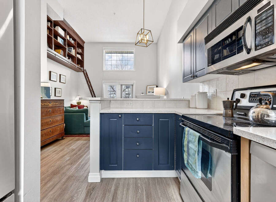Discover this stunning property featuring a modern kitchen with sleek cabinetry and stainless steel appliances.