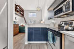 Discover this stunning property featuring a modern kitchen with sleek cabinetry and stainless steel appliances.