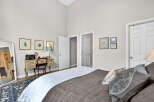 This charming bedroom offers a serene retreat with its elegant design and inviting ambiance.