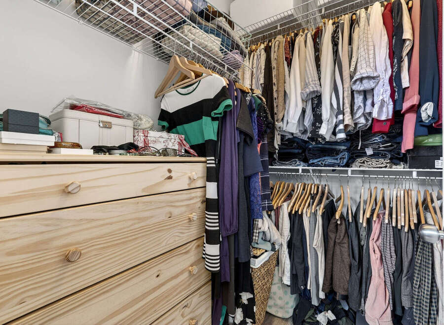 Discover the perfect blend of organization and style in this well-designed closet.