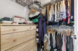 Discover the perfect blend of organization and style in this well-designed closet.