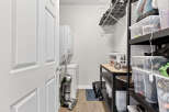 Discover the convenience of this well-organized laundry room, featuring a modern washer and dryer setup.