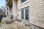 Discover this stunning property featuring a beautiful brick patio and elegant double doors.