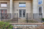 Discover this charming property featuring a welcoming patio with a stylish wrought iron fence.
