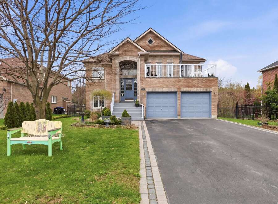 This stunning brick home offers a blend of elegance and comfort, perfect for families.