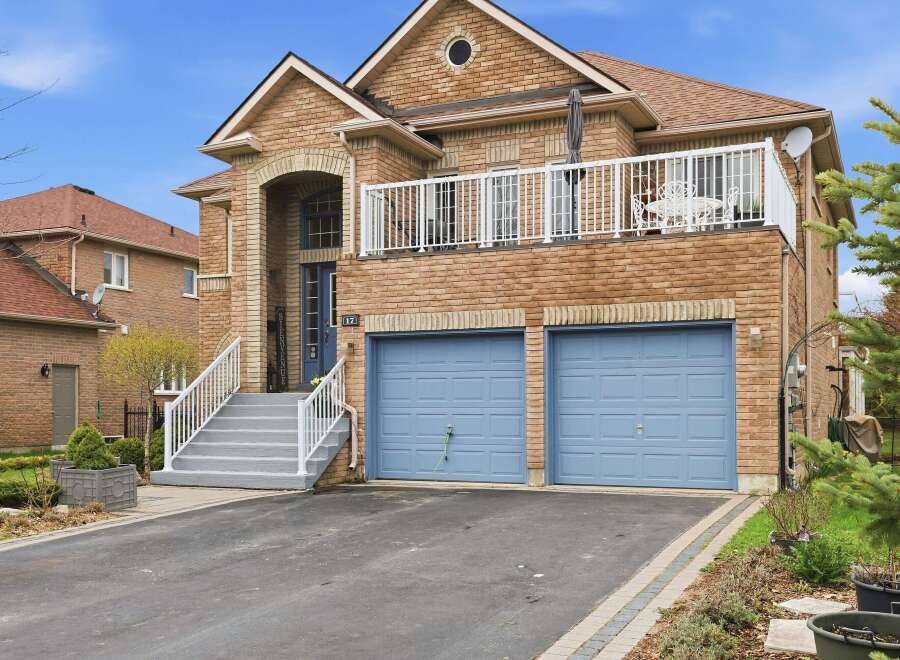 This stunning brick home boasts a charming facade and a welcoming entrance.
