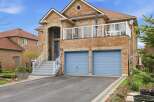 This stunning brick home boasts a charming facade and a welcoming entrance.