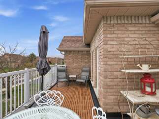 Enjoy outdoor living at its finest on this stunning balcony! This property features a beautifully designed space with comfortable seating, perfect for relaxing or entertaining.