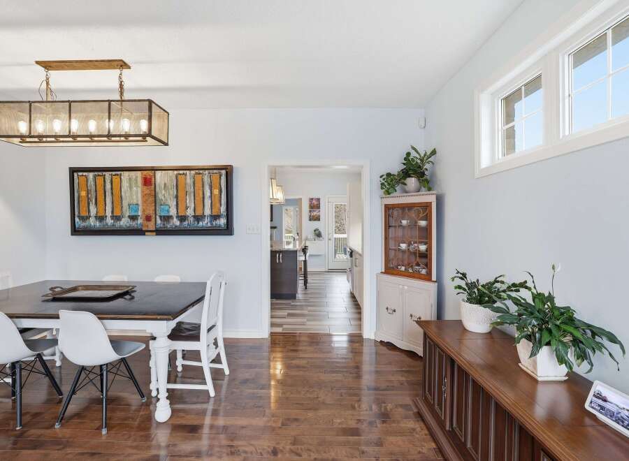 Step into this inviting dining room, showcasing a blend of modern and classic design elements.