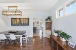 Step into this inviting dining room, showcasing a blend of modern and classic design elements.