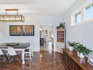 Step into this inviting dining room, showcasing a blend of modern and classic design elements.