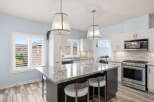 This stunning kitchen boasts a modern design with a spacious island, perfect for entertaining.