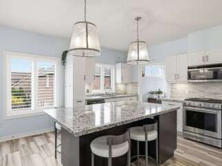 This stunning kitchen boasts a modern design with a spacious island, perfect for entertaining.