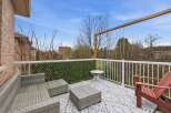 Enjoy outdoor living at its finest on this beautiful deck! This space features comfortable seating, a stylish coffee table, and a charming accent wall.