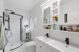 Step into a modern oasis with this stunning bathroom.
