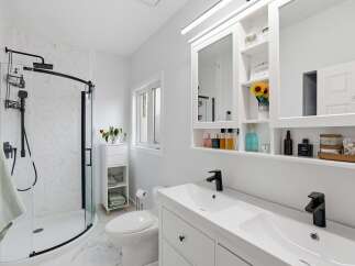 Step into a modern oasis with this stunning bathroom.