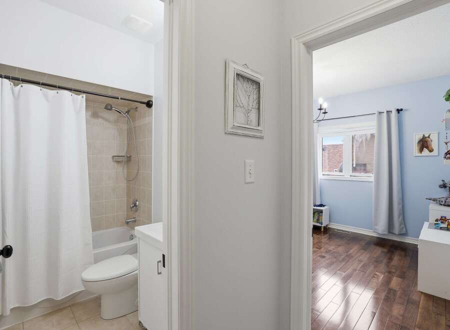 Step into this inviting home and discover a well-maintained bathroom featuring a clean, bright aesthetic.