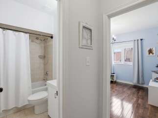 Step into this inviting home and discover a well-maintained bathroom featuring a clean, bright aesthetic.