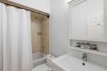 This bathroom features a clean and modern design, perfect for a relaxing retreat.