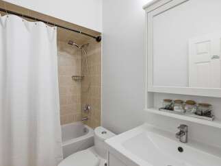 This bathroom features a clean and modern design, perfect for a relaxing retreat.