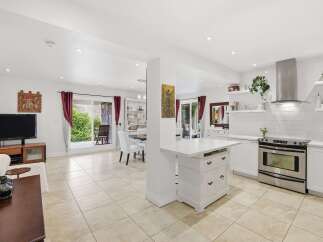 This stunning property boasts a bright and airy open-concept design, perfect for modern living.