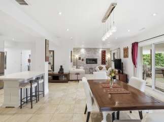 Step into luxury with this stunning property, showcasing an open-concept living space perfect for entertaining.