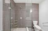 Step into a modern bathroom oasis! This stunning space features a sleek glass shower enclosure, perfect for a spa-like experience.
