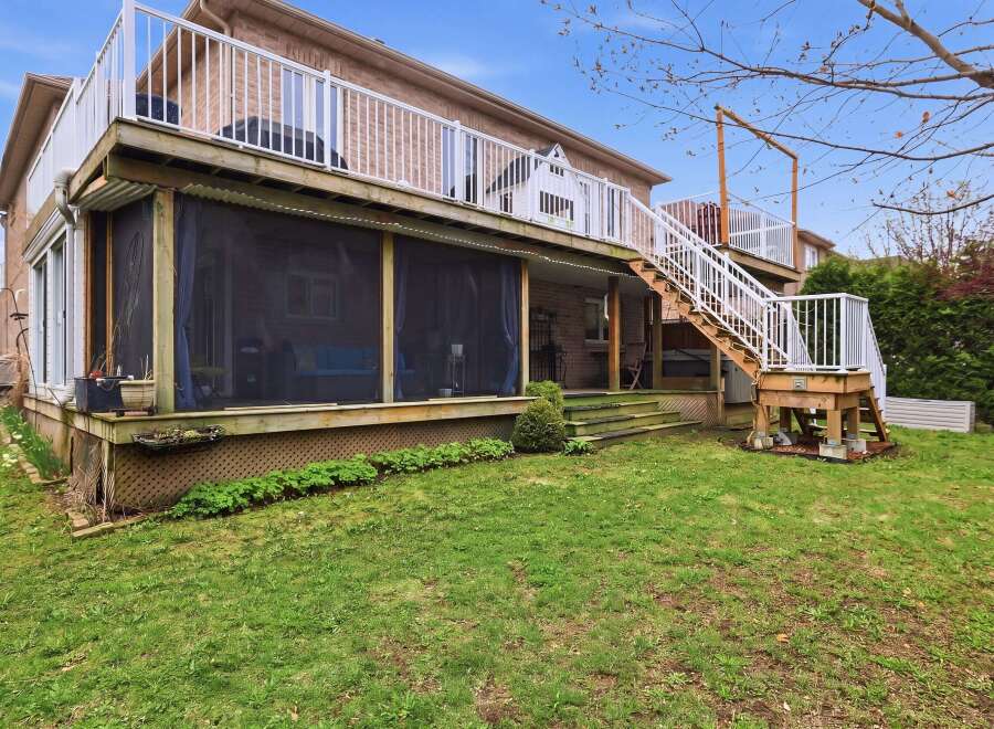 Enjoy outdoor living at its finest with this stunning property featuring a multi-level deck and screened-in porch.