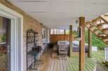 Enjoy outdoor living at its finest with this charming property featuring a covered deck.