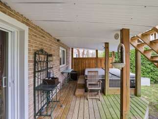 Enjoy outdoor living at its finest with this charming property featuring a covered deck.