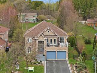 This stunning property boasts a beautiful brick exterior and a charming curb appeal.