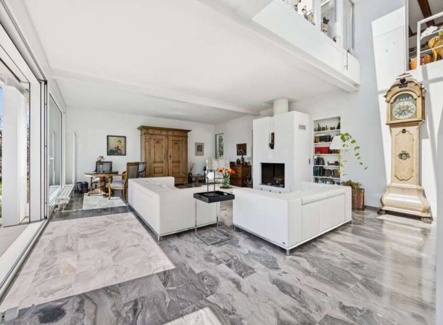 Experience luxurious living in this spacious, light-filled open-concept living area.