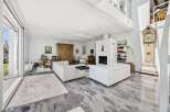 Experience luxurious living in this spacious, light-filled open-concept living area.