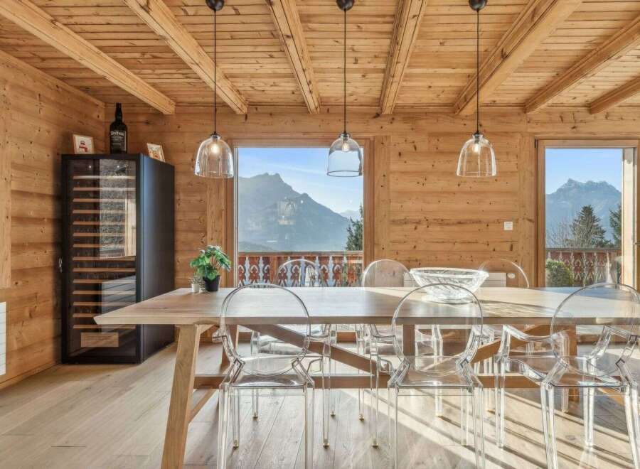 Experience luxury living in this stunning property featuring a dining area with breathtaking mountain views.